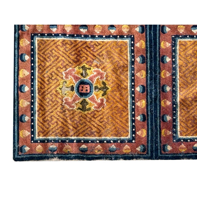 This handcrafted Tibetan-style rug features a striking geometric layout, meticulously divided into six symmetrical...