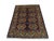 Eight green geometric medallions stand out against the deep navy field of this wool rug. Layered tribal borders repeat the...