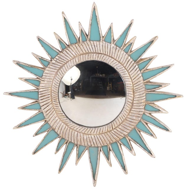 A beautiful one of a kind mirror! The textured turquoise resin “sunrays” are inset into a silver frame arranged in a...