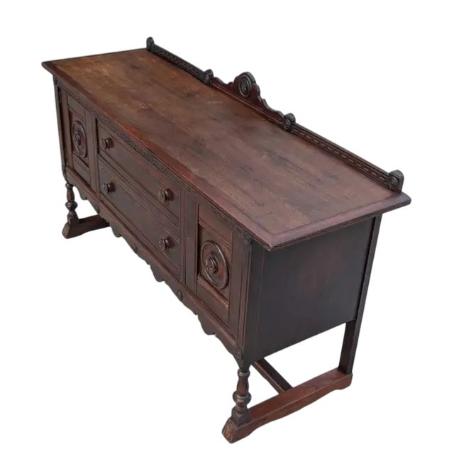 Very rare to find a signed Baker Furniture piece a century old. This magnificent dark finished walnut Spanish Revival...