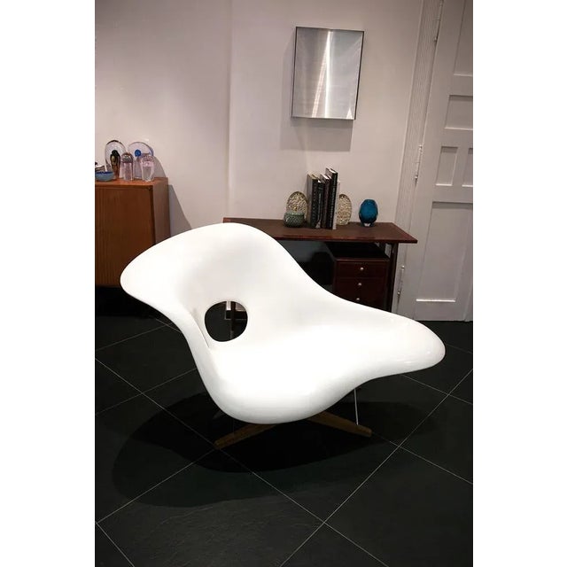 The iconic lounge chair "la chaise" was designed by charles and ray eames for the international furniture design...