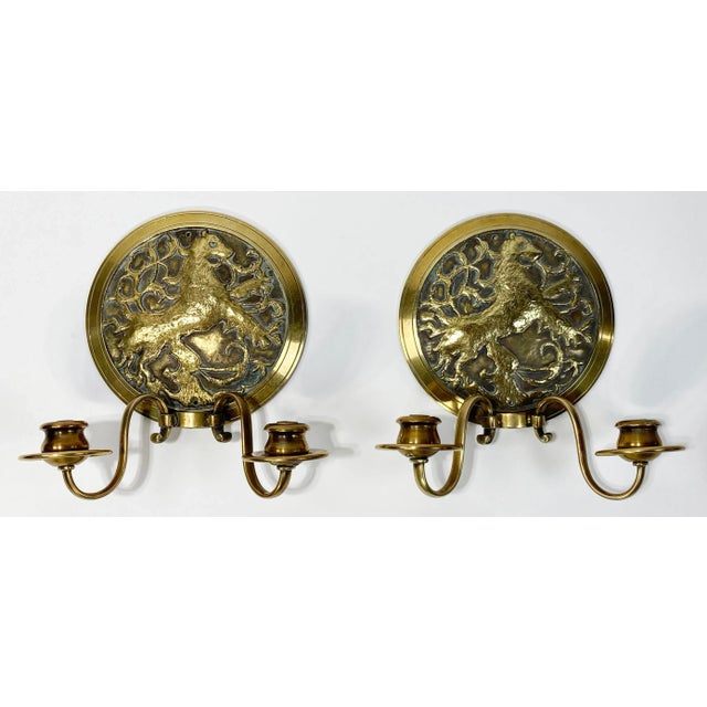 Pair of incredible antique cast bronze electrified wall sconces featuring lion crest emblem engraved in each medallion....