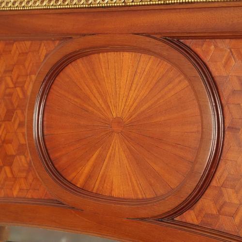 This elaborately crafted wall mirror dates from around 1890 and displays an elegant design that combines elements of late...