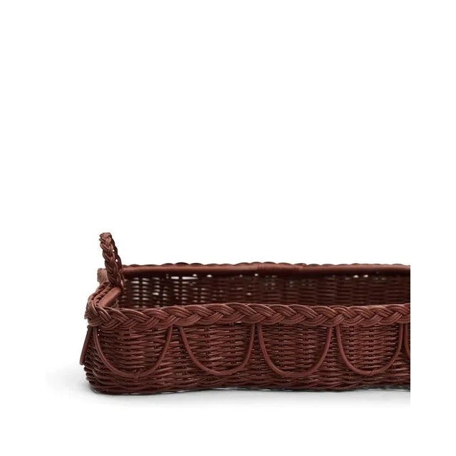 Handcrafted from 100% natural rattan, featuring fixed handles and a beautifully braided, scalloped edge, the Hadley tray...