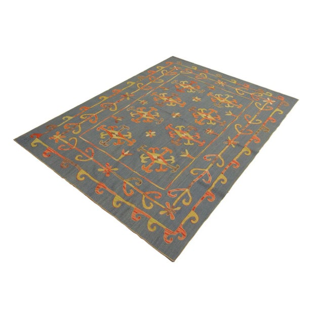 Add a touch of elegance to your home with this casual chic hand woven Tribal embroidered Kilim Wool Rug. Constructed on a...