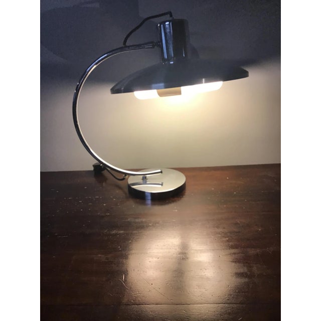 This Space Age table lamp in satin-finish steel has a newly replaced neon circle light. European Plug (up to 250V).The...