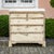 Light gray-painted chest of drawers from the George III period, featuring five drawers and shaped bracket feet. The finish...