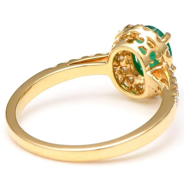 This lovely ring features a stunning stone that will stand out in a crowd. The lovely emerald is accented by a gorgeous...