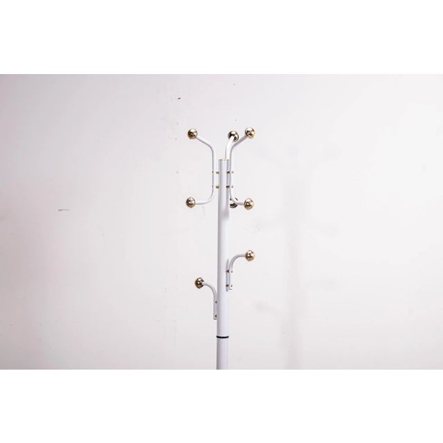 Modernist sputnik stycle coat rack. Made from metal and plastic with a stone weighted base. Very Useable piece of design...