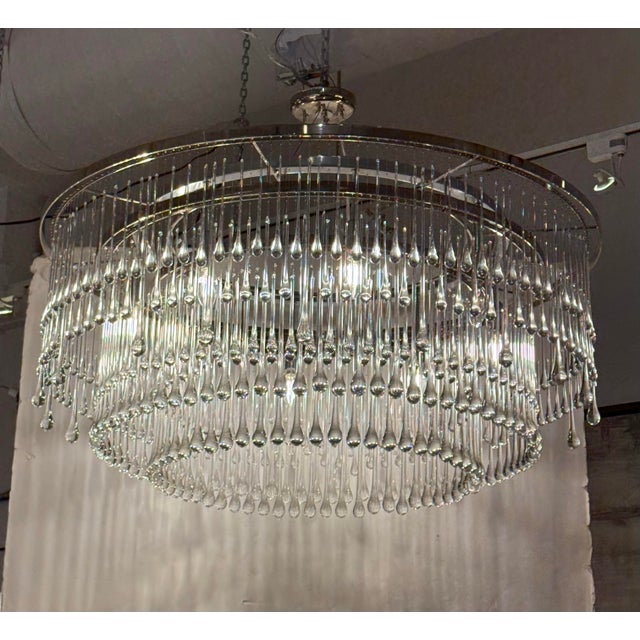Design Plus Gallery presents the Light Drizzle Round Chandelier by Ochre. A polished nickel frame supports three graduated...
