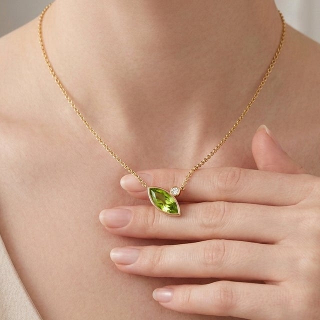 Gracefully designed to capture timeless elegance, this Marquise Peridot Necklace is crafted in 18K gold plated over 925...