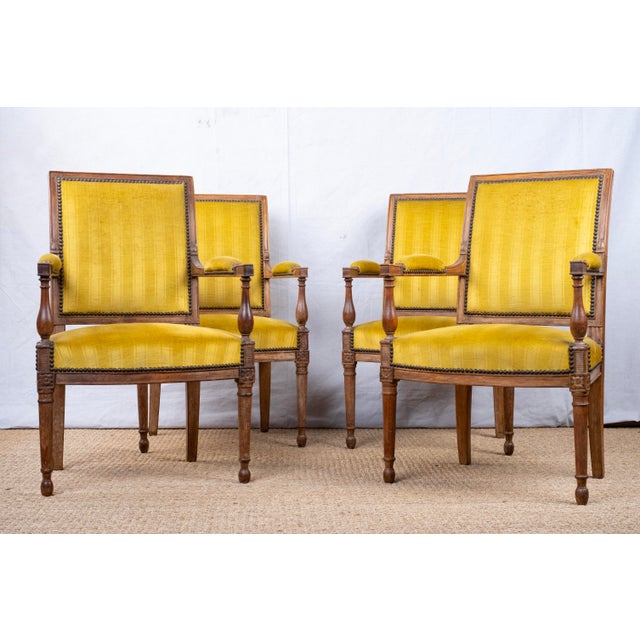 A set of four antique armchairs or fauteuils, Directoire style, c. 1820, French. All chairs feature gold velvet upholstery...