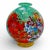 A stunning handblown Murano art glass vase featuring the iconic Millefiori design in vivid reds, blues, greens, and gold....
