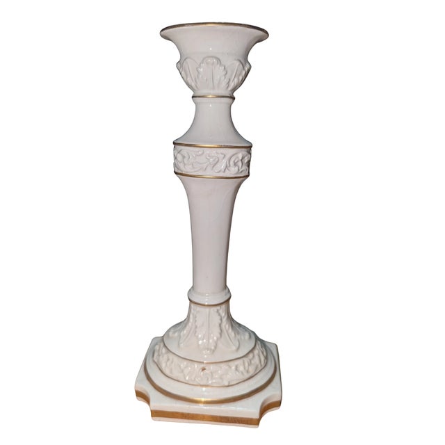 Pair of tall, cream-white porcelain "Capodimonte-style" candlesticks, a decorative revival that echoed 18th-century...