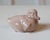 A charming porcelain duckling by Royal Copenhagen, renowned for its exceptional Danish craftsmanship and delicate...