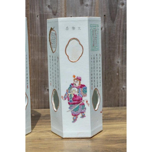 An impressive pair of Chinese porcelain hat stands decorated in the celebrated Wushuang Pu tradition, combining colourful...