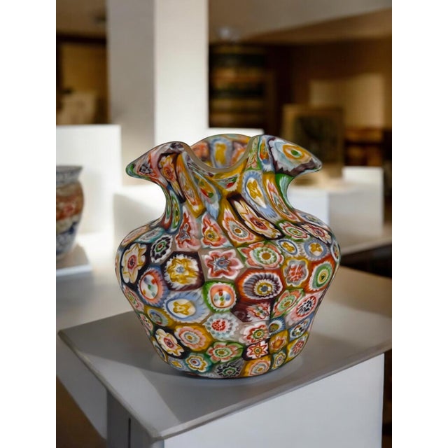 A miniature Italian Millefiori glass pitcher. The Millefiori glass gives a beautiful multicolored and multi dimensional...