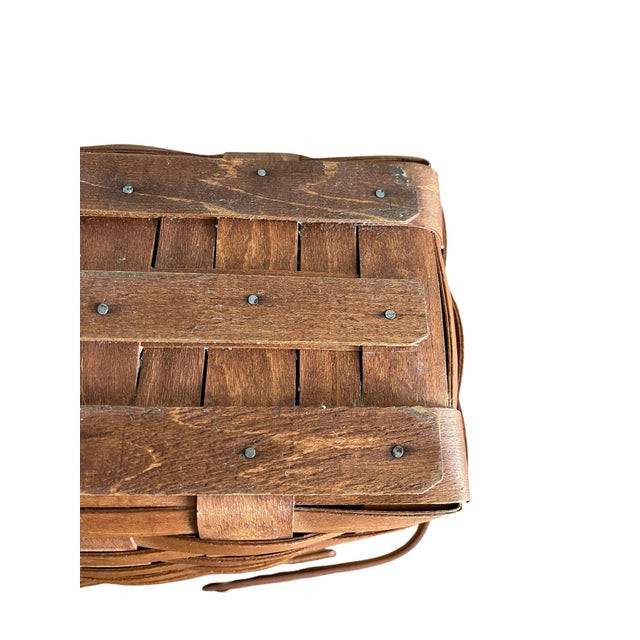 This vintage Longaberger handwoven maple wood basket is a timeless example of classic American craftsmanship. Expertly...