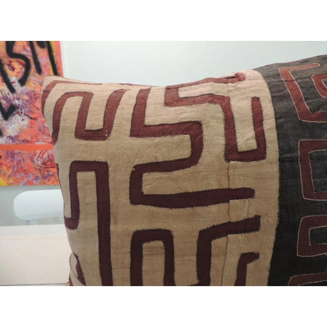African Pillow in Black and Burnt Orange Raffia Kuba Cloth With soft grey cotton woven backing. Size: 23"W x 22"H x 10"H...
