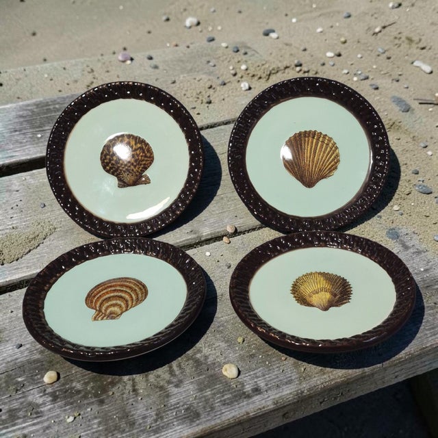 The Coastal Set of 4 Small Sea Shell Mud-Pie Fiji Tidbit Dishes features a charming design inspired by the ocean. Made of...