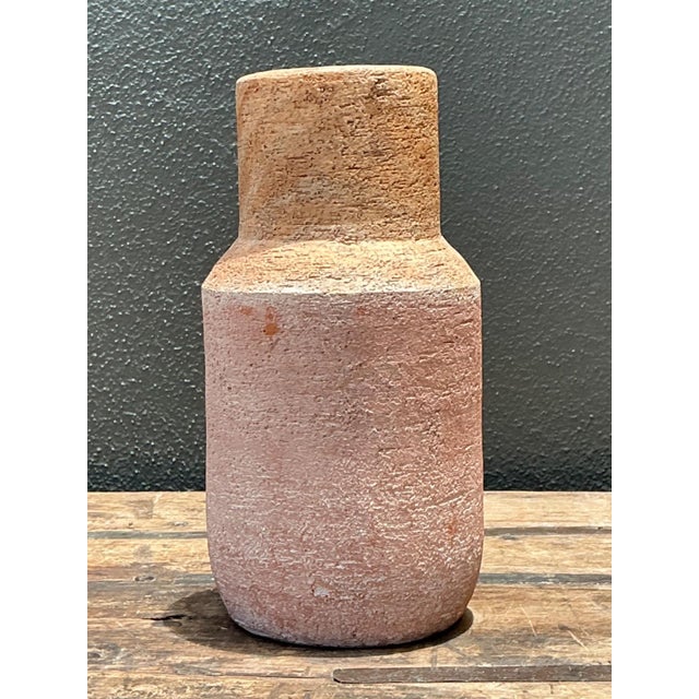 This exceptional vintage studio pottery vase embodies the quiet power of organic modernism, featuring a clean cylindrical...