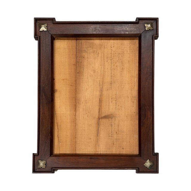 Elegant French Directoire frames crafted from warm walnut, accented with refined brass mounts—exemplifying the era’s crisp...