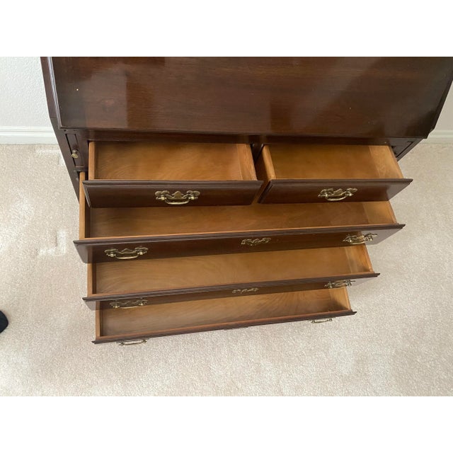 Ethan Allen Georgian Court Cherry Drop Front Secretary Desk with Curio/Bookcase Hutch/Top. Late 20th Century. It measures...