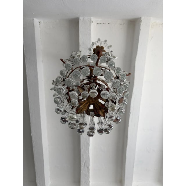 I have two of these and matching sconces on sale as well. Housing 3 lights, sitting in crystal bobeches, dripping with...