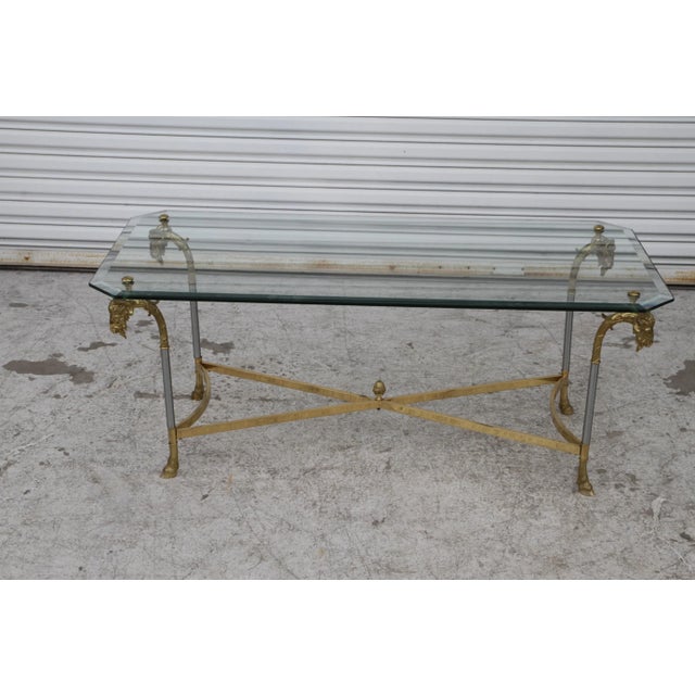 A beautiful Vintage Ram's Head Coffee Cocktail Table with hooved legs. Dimensions: Length: 47" Width: 23" Height: 18"