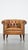 Offered is this antique, characteristic sheepskin chesterfield club chair on wheels. Dimensions: Height: 74 cm Width: 86...