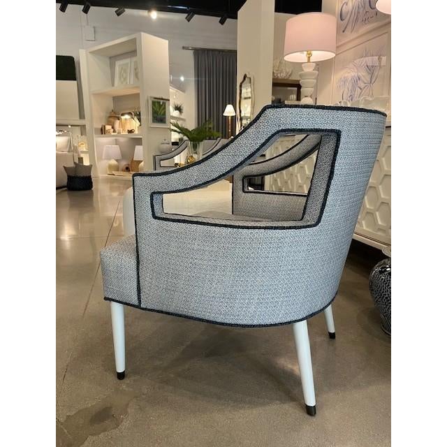 Generous proportions update this mid century lounge chair, easily transitioning from a coastal interior to a relaxed...