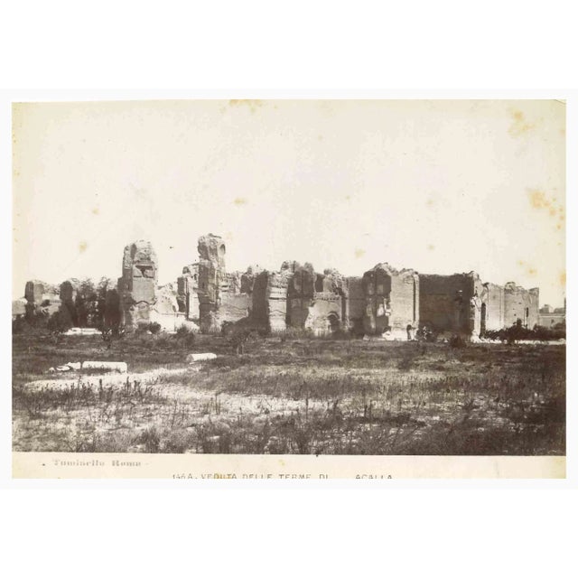Baths of Caracalla is a vintage sepia photograph realized by Ludovico Tuminello in the early 20th Century. Titled on the...