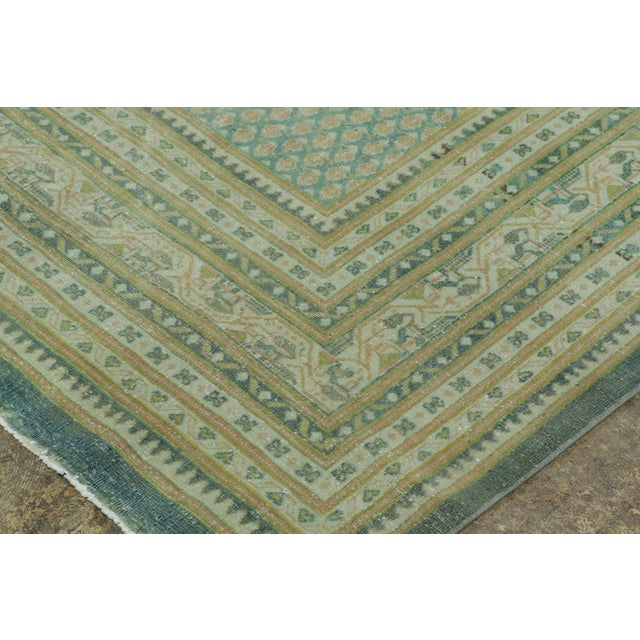 Hand-knotted in wool circa 1910-1919, this 9x12 antique Persian Saraband rug is a striking addition to Rug & Kilim’s...