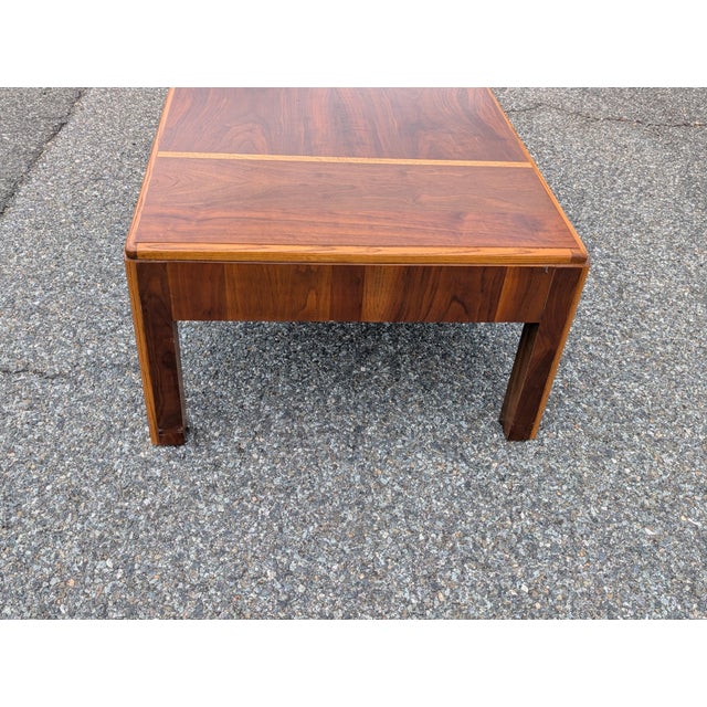 Imbue your living space with refined modernist design with this vintage Lane "Rhythm" group midcentury cocktail table,...