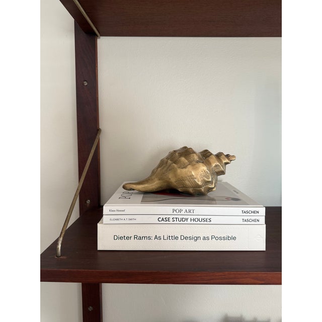 Bring refined coastal elegance into your home with this stunning vintage solid brass seashell sculpture. Measuring 10”...