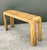 A beautiful expression of mid-century craftsmanship, this vintage rattan waterfall console table showcases the effortless...