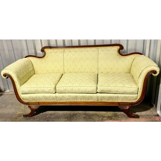 Introduce a classic elegance into a modern home with this timeless sofa offering historical charm and eye catching appeal...