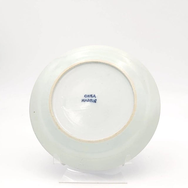 A Nanking Chinese export blue and white plate, circa 1840, with later mark on back "China Made In".