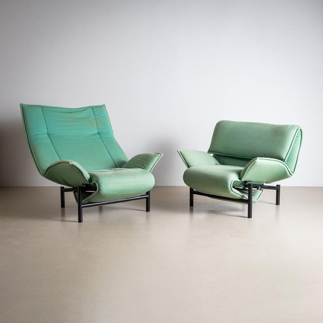 A pair of modern "Veranda" armchairs designed by Vico Magistretti for Cassina, produced in Italy in the late 20th century....