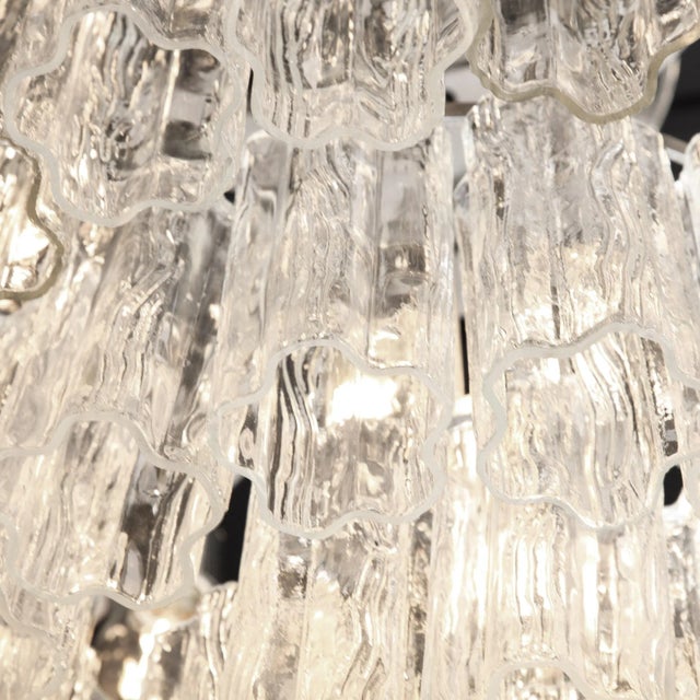 This refined and large scale modernist tronchi chandelier was realized in Murano, Italy- the island off the coast of...