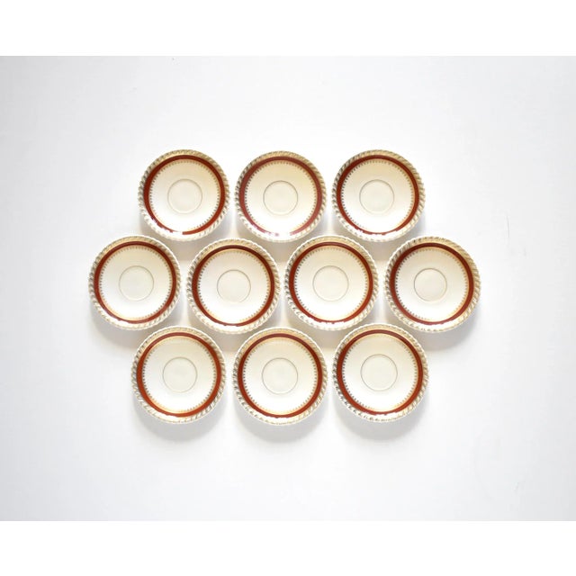 A set of 10 vintage 1934-1948 Lenox china saucers, in the deep red burgundy and gold gilt "Georgian" pattern.