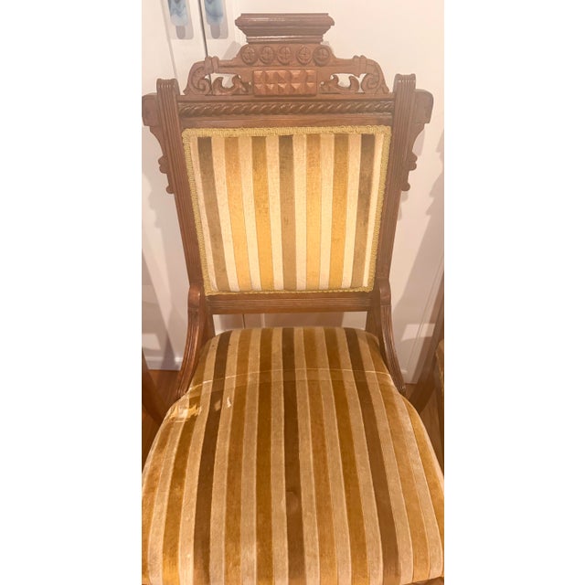 This stunning set of four authentic Eastlake Victorian side chairs (c. 1870–1890) offers a rare combination of historical...