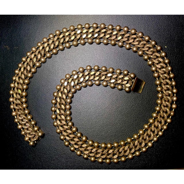 A thick 16”industrial-chic metal mesh and multi-chain collar neckpiece dense, multi-row construction composed of double...