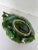 Charming serving dish suitable for sauce, nuts, chutney etc. Green leaf with a plum handle. From a prominent designers...