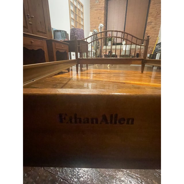 Vintage Ethan Allen solid wood bed frame featuring a beautifully curved sleigh-style headboard and footboard with classic...