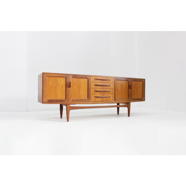 Vintage sideboard from the 1960s by the English brand G-plan. The sideboard is from Great Britain, 1960s. Large size with...