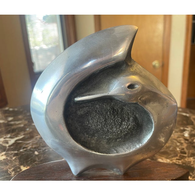 Contemporary curved duck sculpture in pewter on wood base with marking. The wood base is 2 inches tall - 9 inches long - 3...