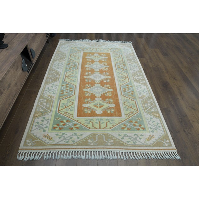 Vintage Turkish Hand-Knotted vintage rug is a semi-antique vintage area rug. The '70s Eastern region of Turkey's unique...