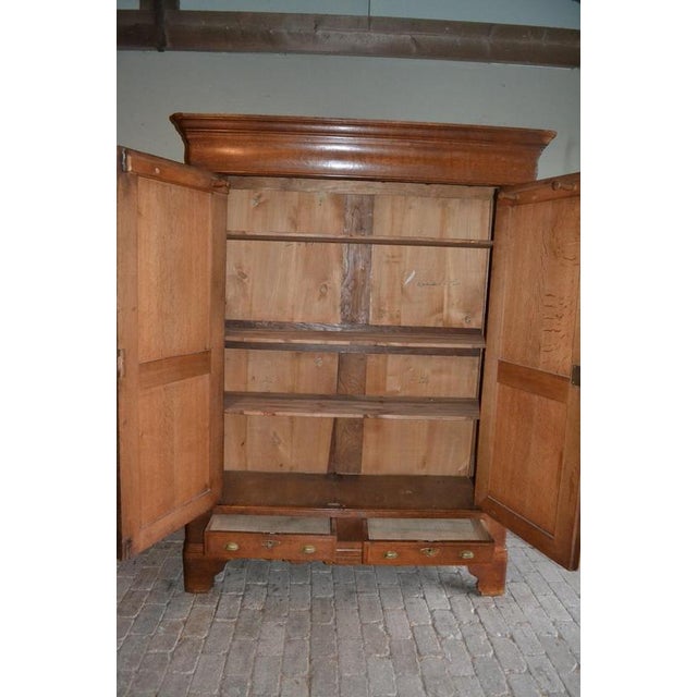 19th-century Belgian oak Louis Philippe cabinet. It is 211 cm high, 160 cm wide, and 54 cm deep. Height-adjustable shelves...