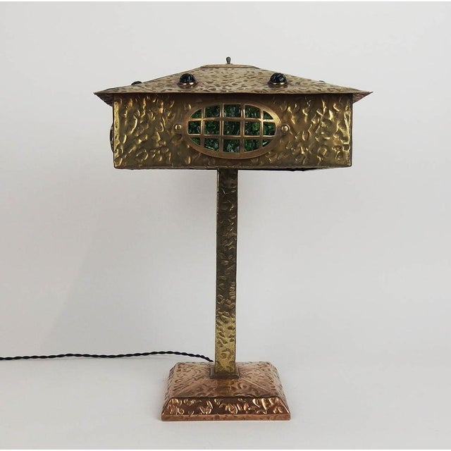 Embossed brass lamp decorated with dots and lines, square lampshade pierced on all four sides of its base with oval...